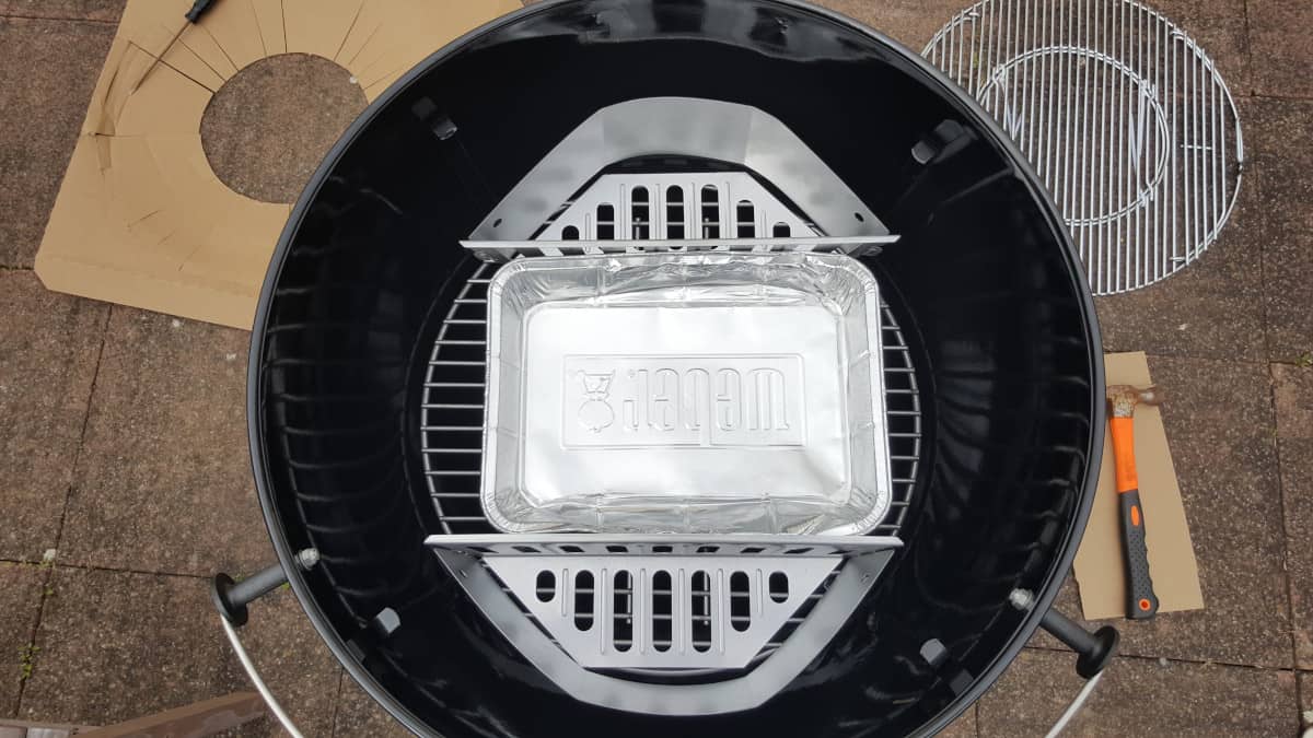 The twin charcoal baskets inside the Weber Master Touch charcoal grill
