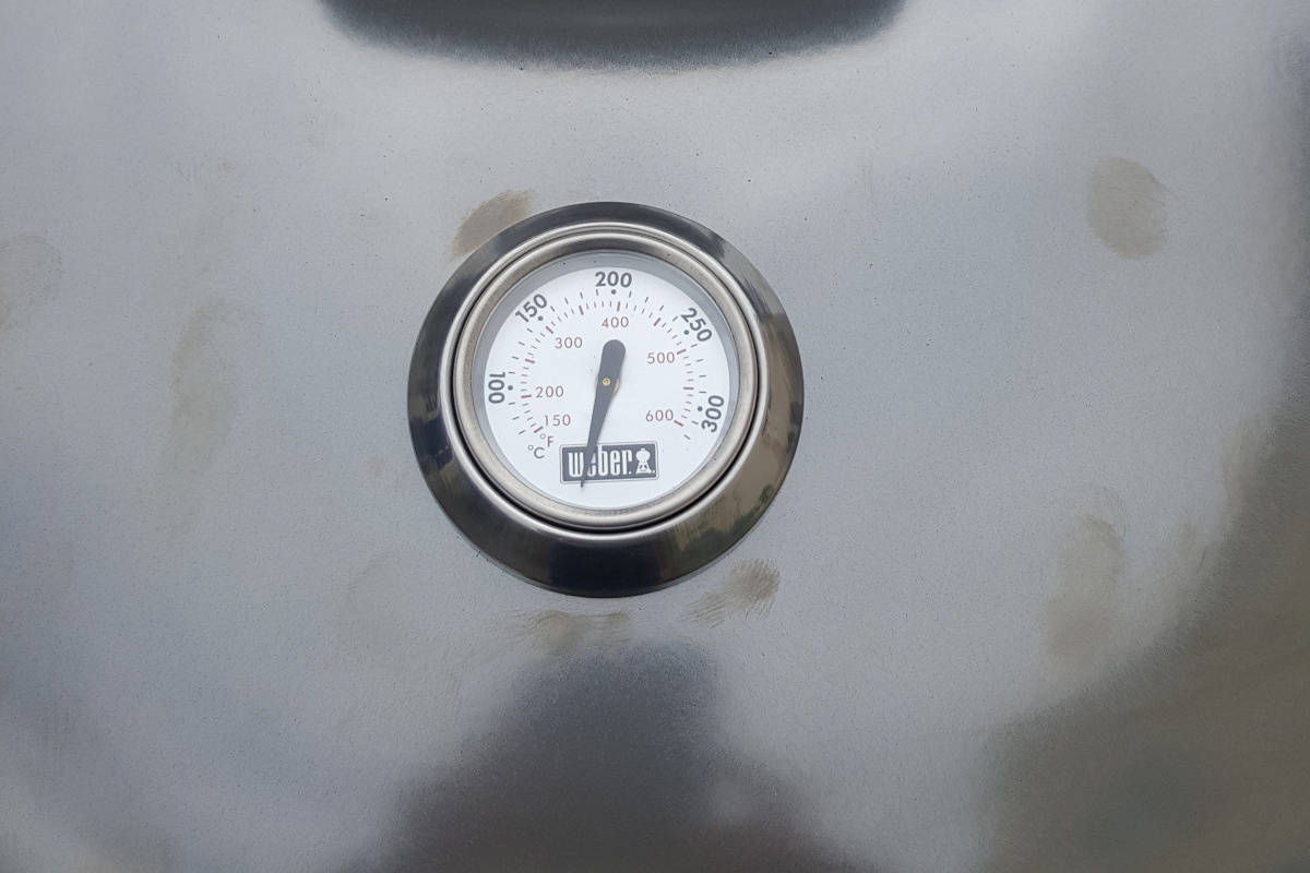 Close up of the Weber Master Touch lid thermome.