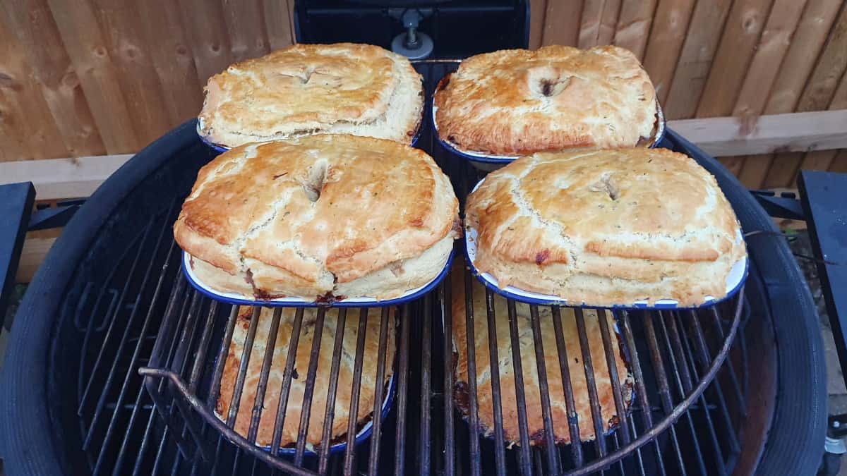 8 pies being baked inside a Kamado Joe Big Joe III