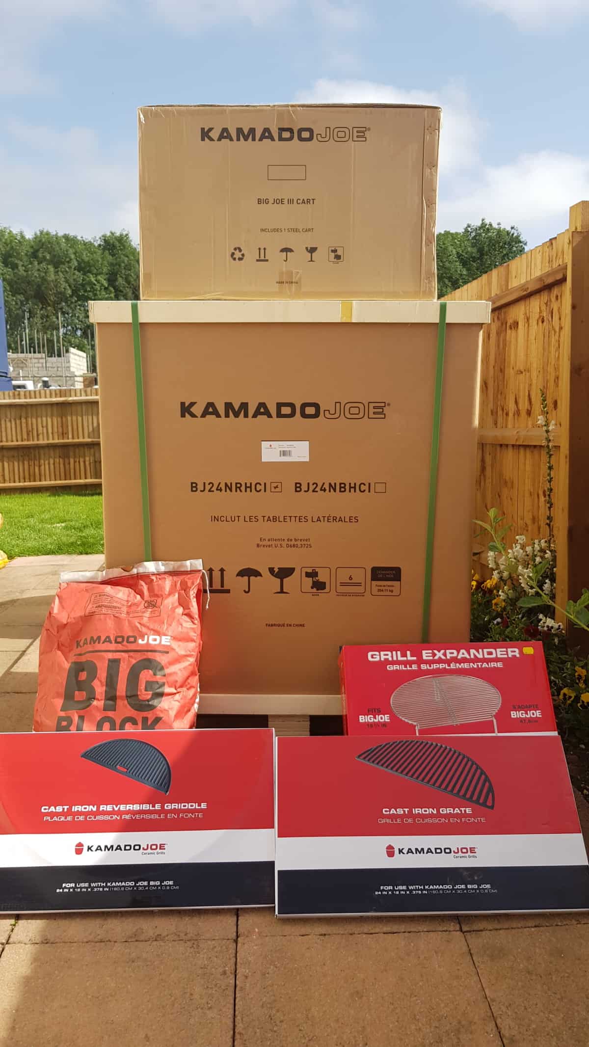 kamado joe big joe 3 as it arrives in 2 large boxes on a wooden pallet.
