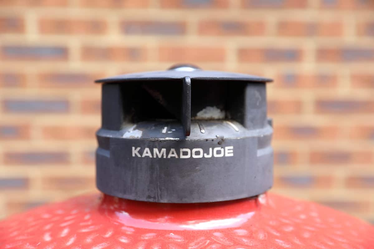 Close up of Kamado Joe Big Joe III kontrol tower top vent peeling