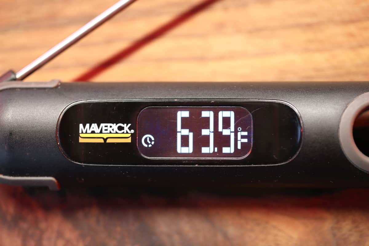The Maverick PT-75 instant read thermometer showing 63.9 degrees Fahrenheit