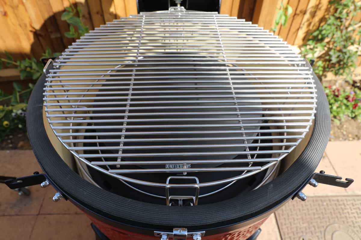 Close up of the inside of the Kamado Joe Big Joe III showing how the grates sit on top of the SloRoller.