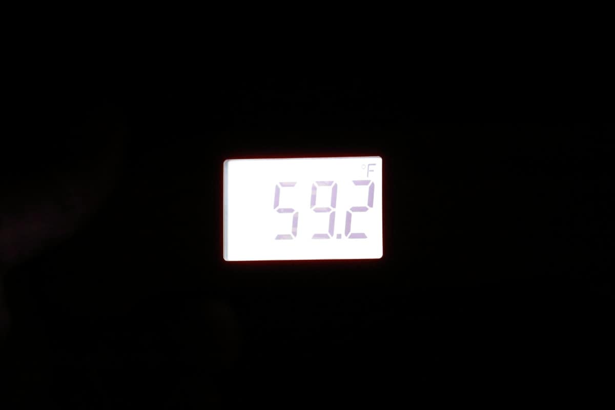 Thermapen One backlit display seen in the dark, displaying 59.2 degrees Celsius