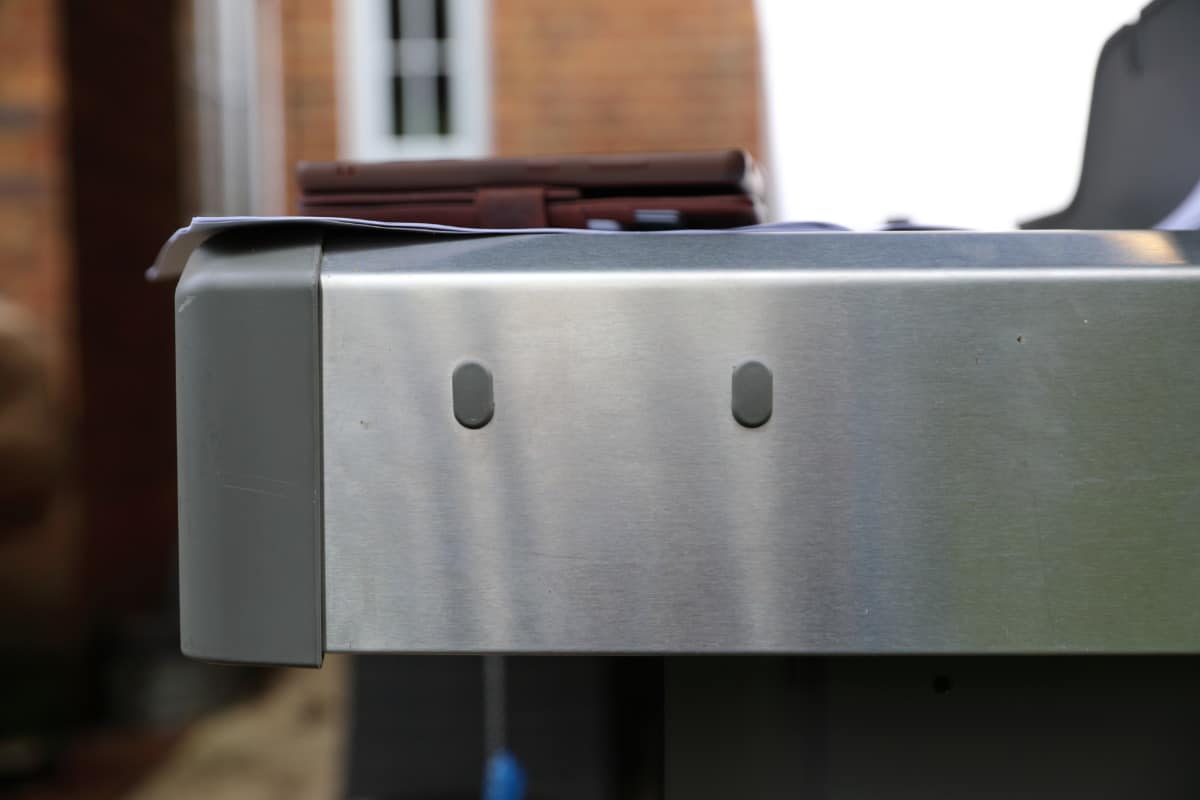 weber genesis side table battery clip holes.