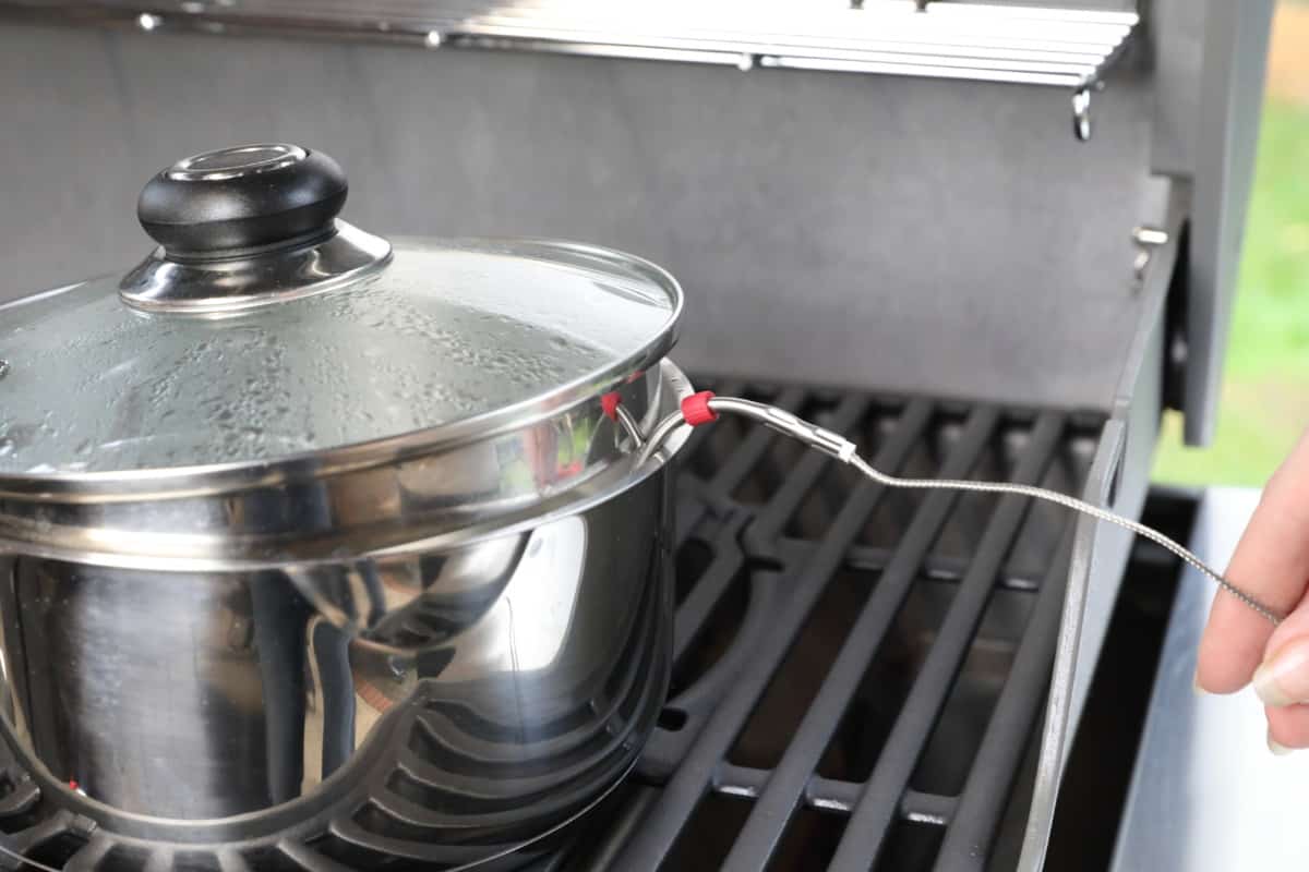 Weber iGrill 3 ambient pit probe in a pan of boiling water