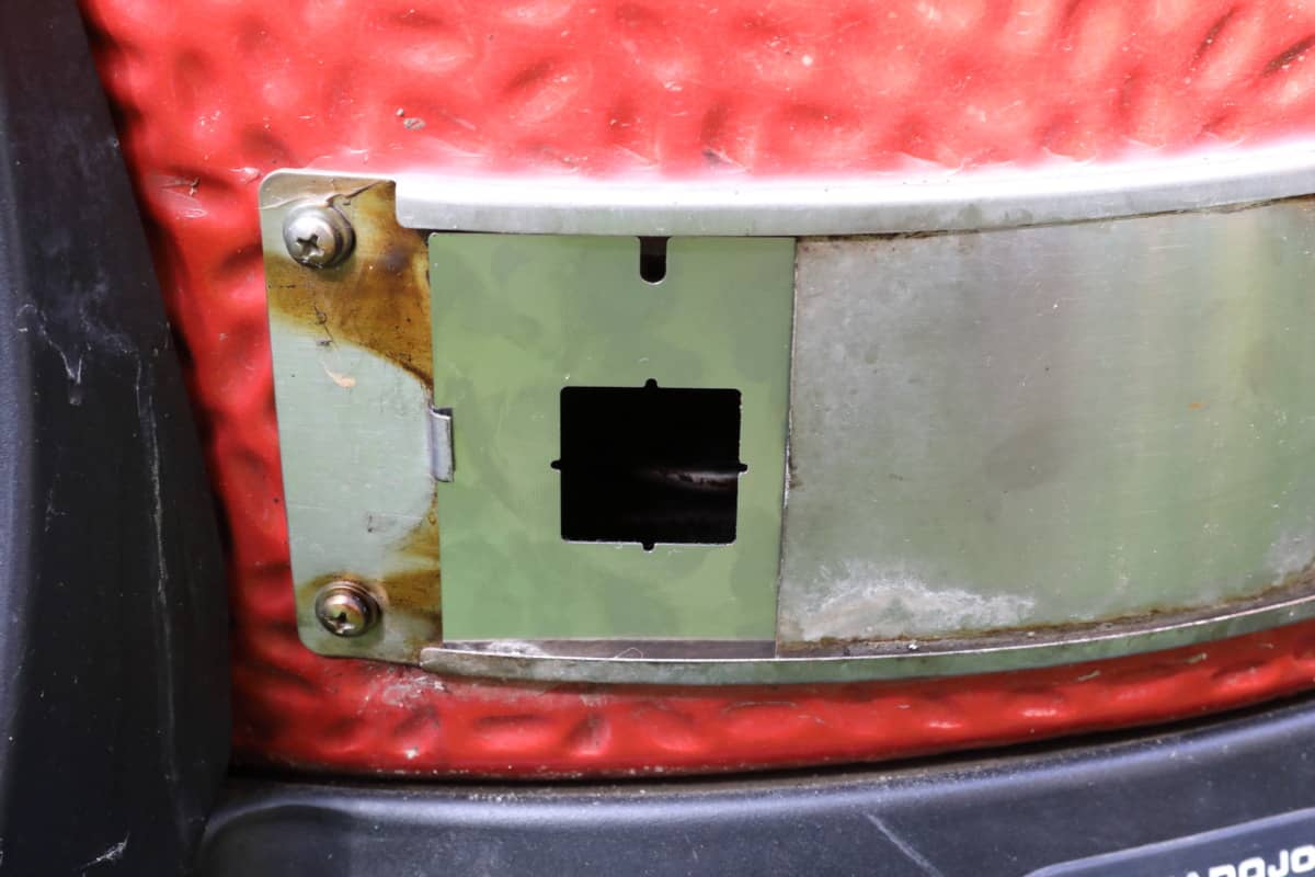 Thermoworks Billows kamado adapter plate inserted into a Kamado joe lower vent.