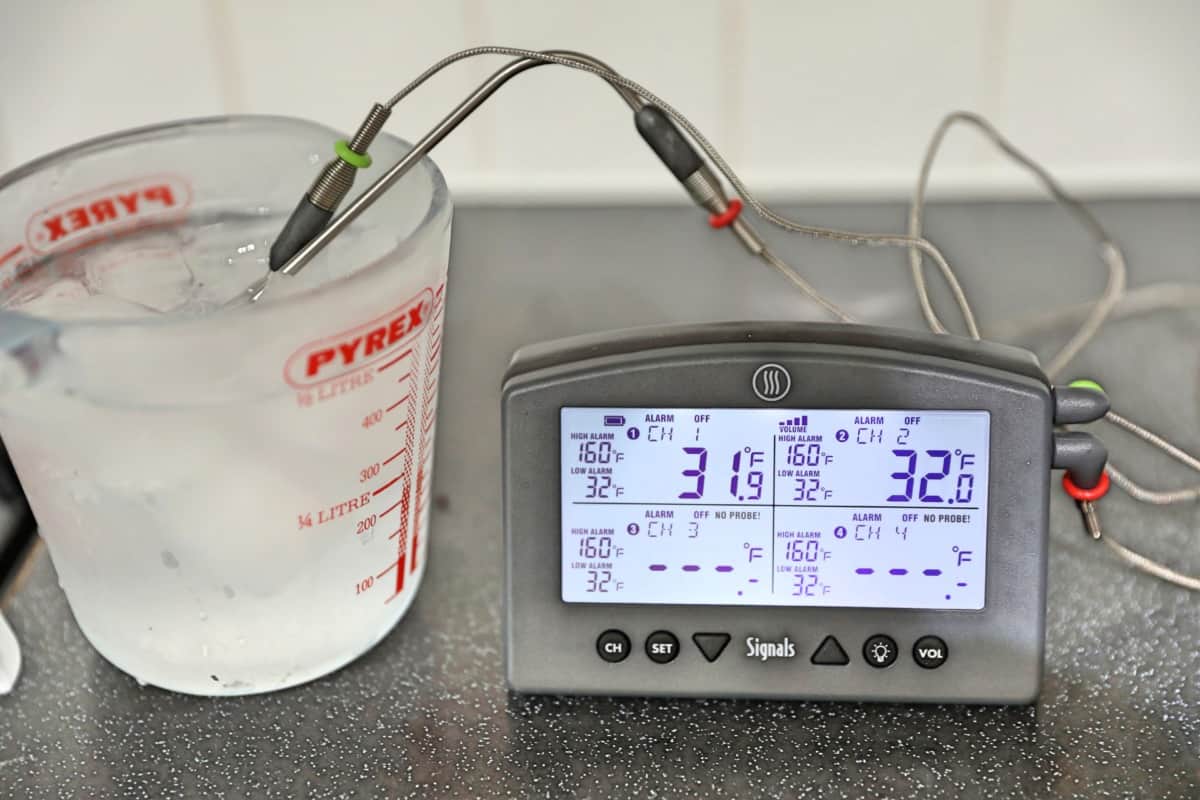 Thermoworks Signals with two temperature probes in a jug of iced wa.