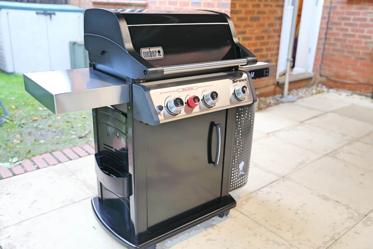 Weber Spirit EPX-325S gas grill on a a patio, shot from the side.