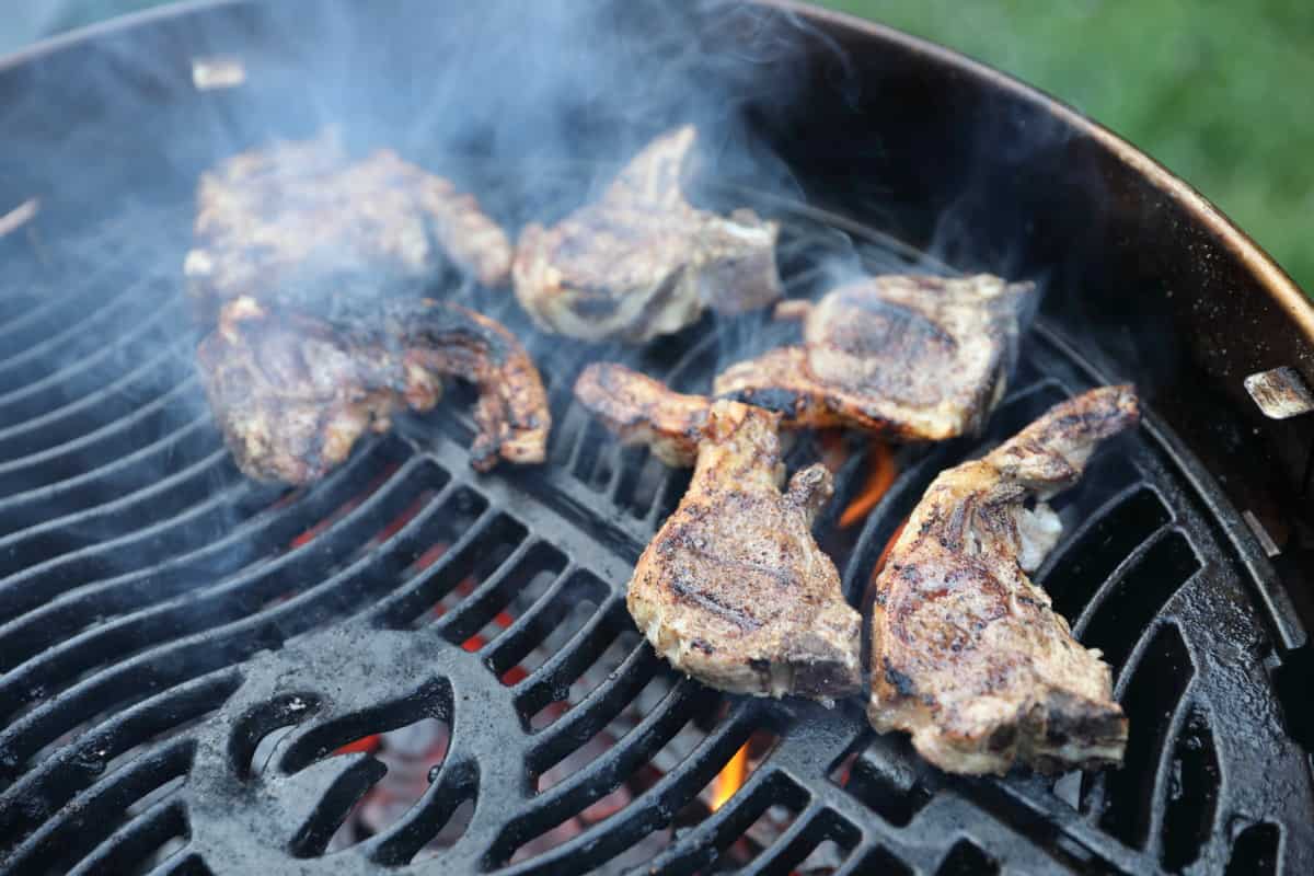 lamb chops being charcoal grilled on the Napoleon PRO22K-LEG-2