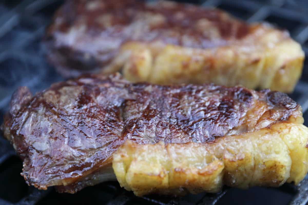 Close up of two seared sirloin stea.