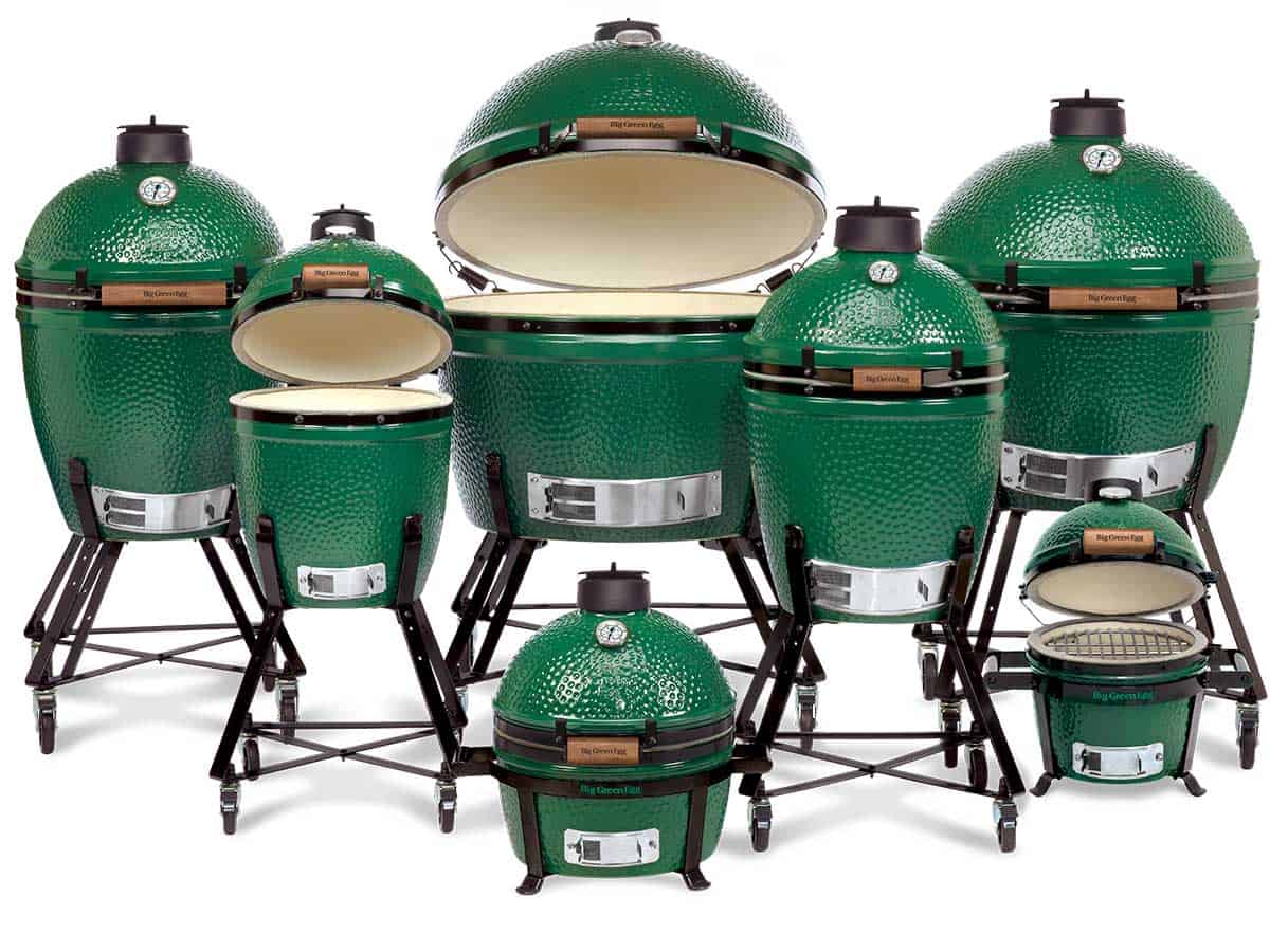 A family of all 7 sizes of Big Green Egg isolated on white