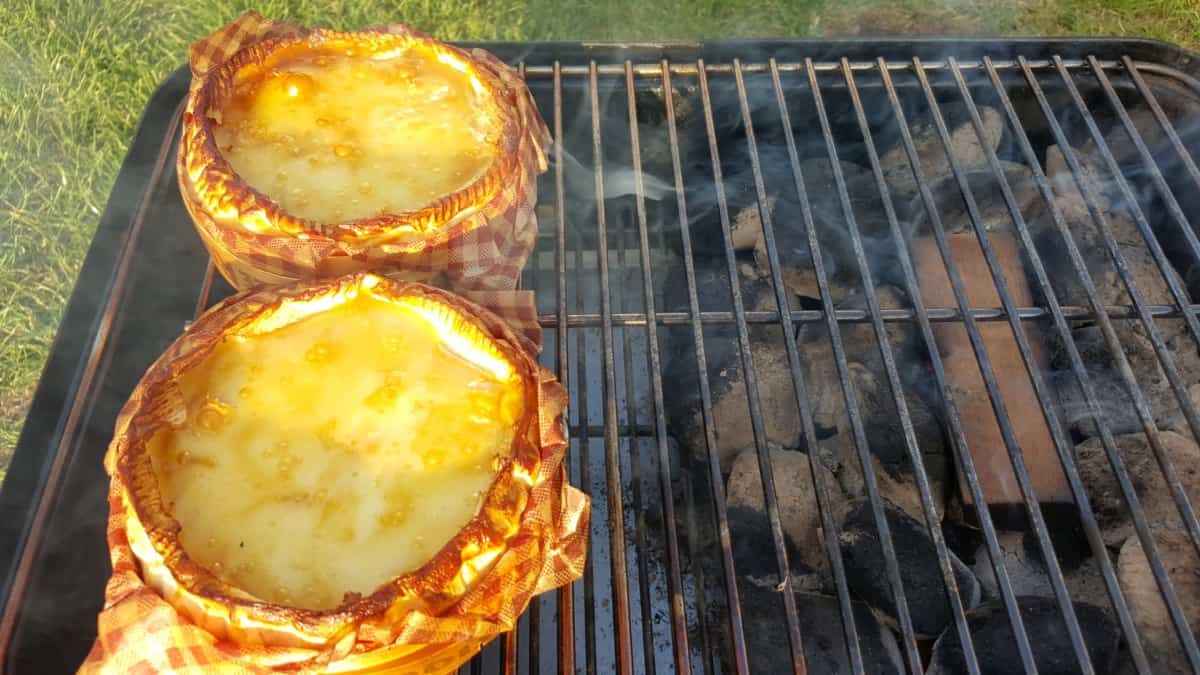 Smoking two camembert cheeses on a Weber Go Anywhere charcoal grill.