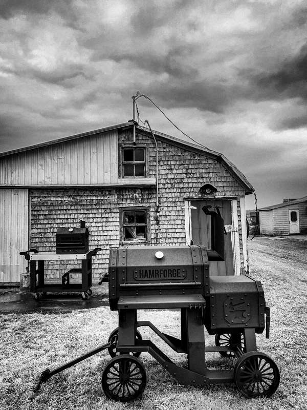 Hamrforge The Beast offset smoker in front of a barn