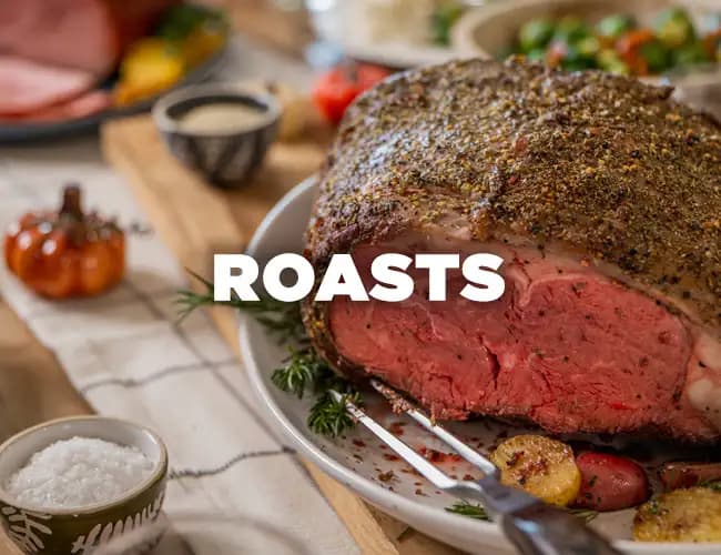 A Snake River Farms roast beef, with the word 'Roasts' written across the photo in white