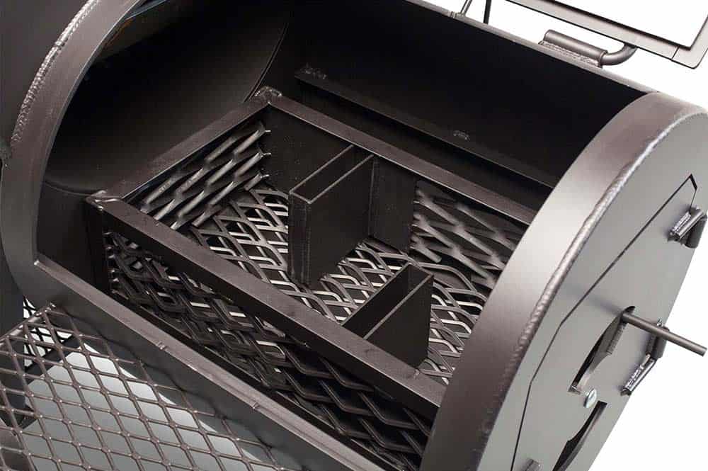 Close up of Yoder Smokers Loaded Wichita firebox with lid open.