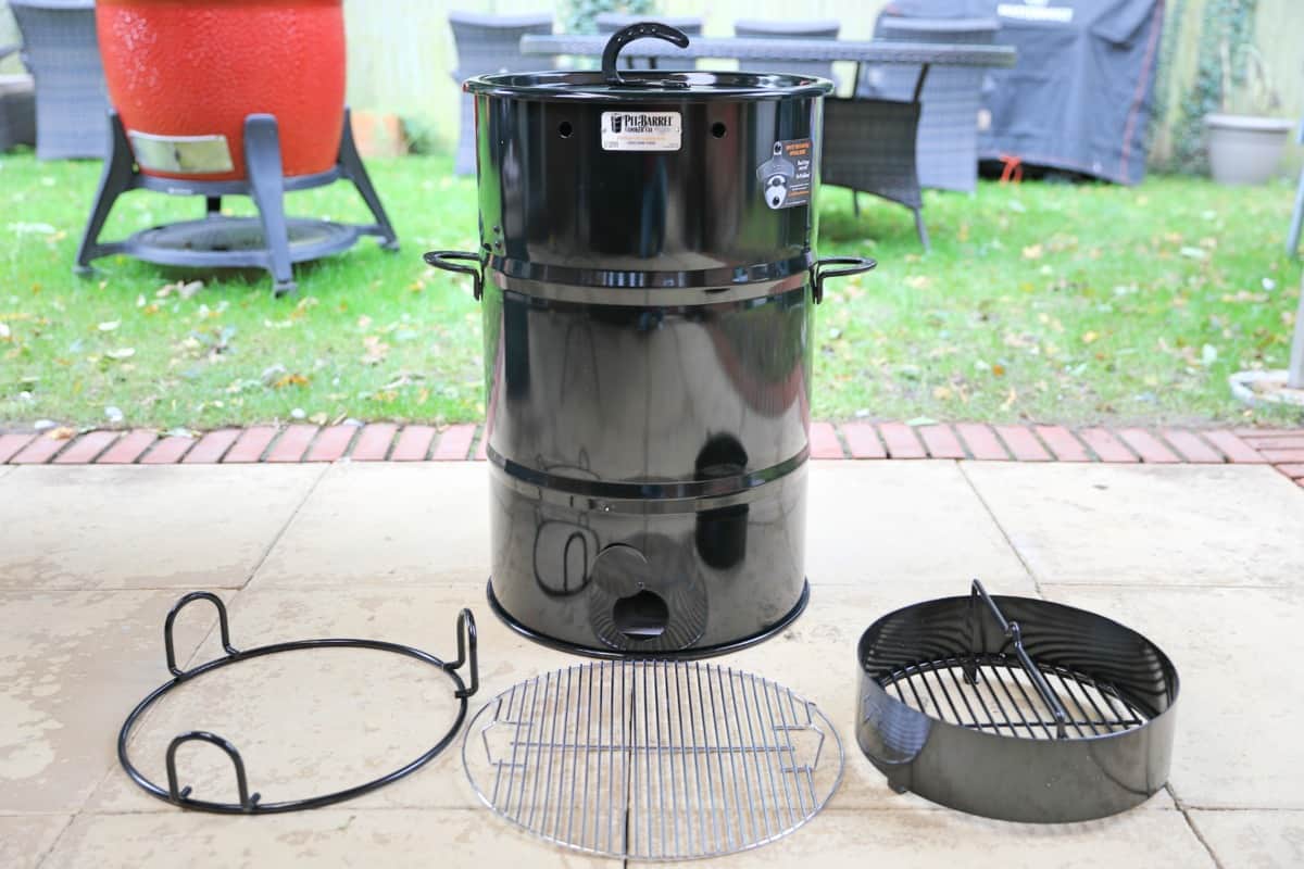 Pit Barrel Cooker on a paved patio.