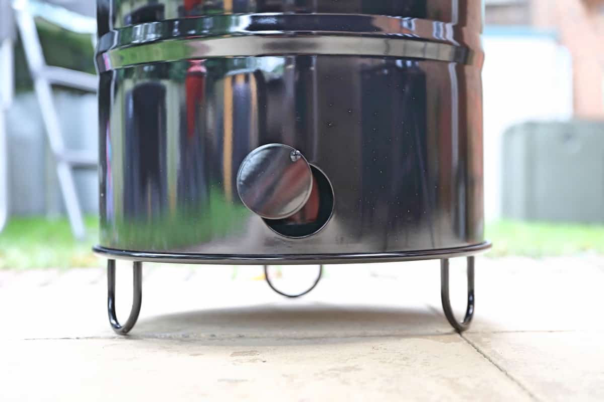 Close up of the Pit Barrel Cooker bottom vent and stand.