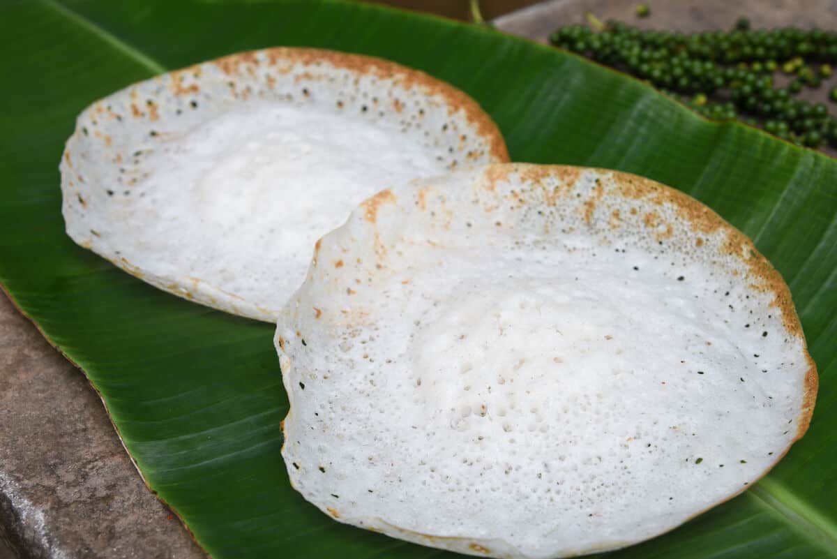 Two appam on a large banana l.
