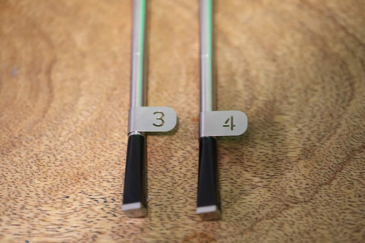 Two MEATER Block probes with metal tags showing the numbers 3 and 4.