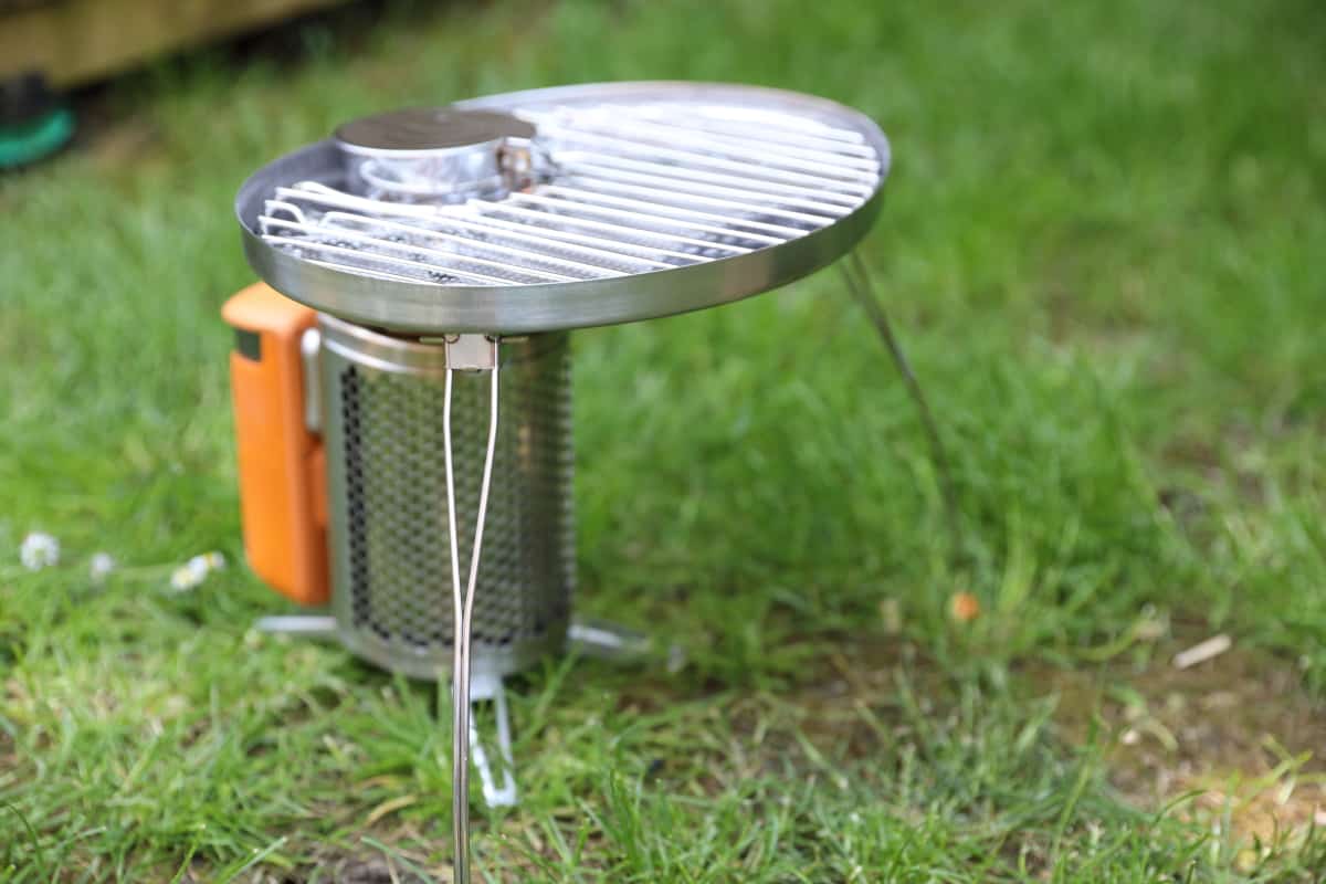 Biolite CampStove with grill attached, showing the two supporting legs on the grill attachment.