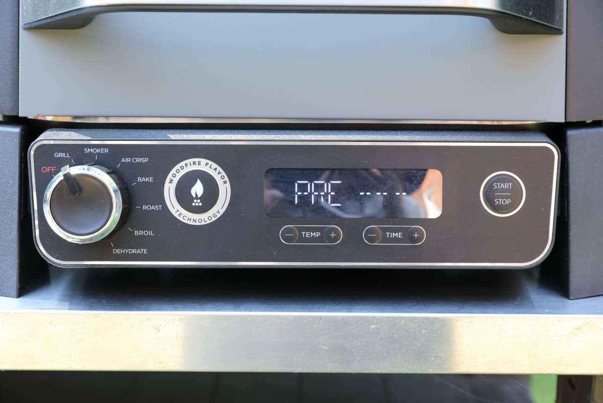 Close up of the control panel of the Ninja Woodfire showing 'PRE.'