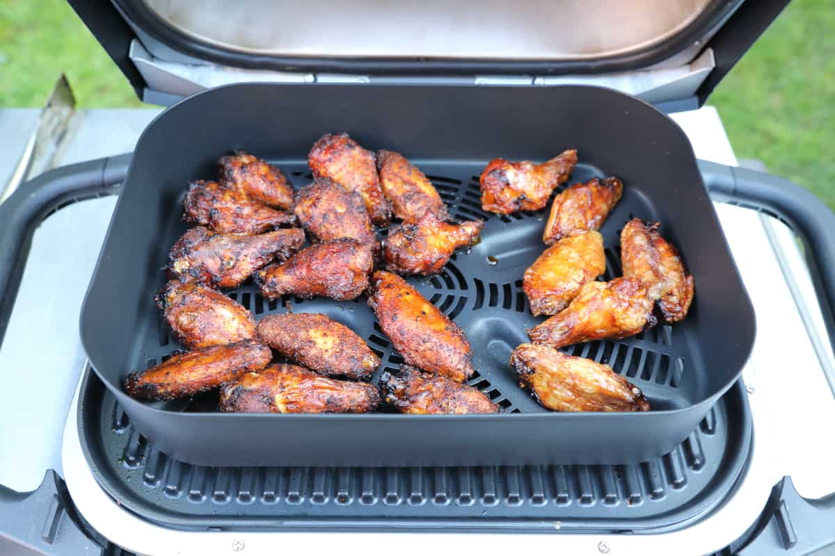 Chicken wings air frying on the Ninja Woodfire.