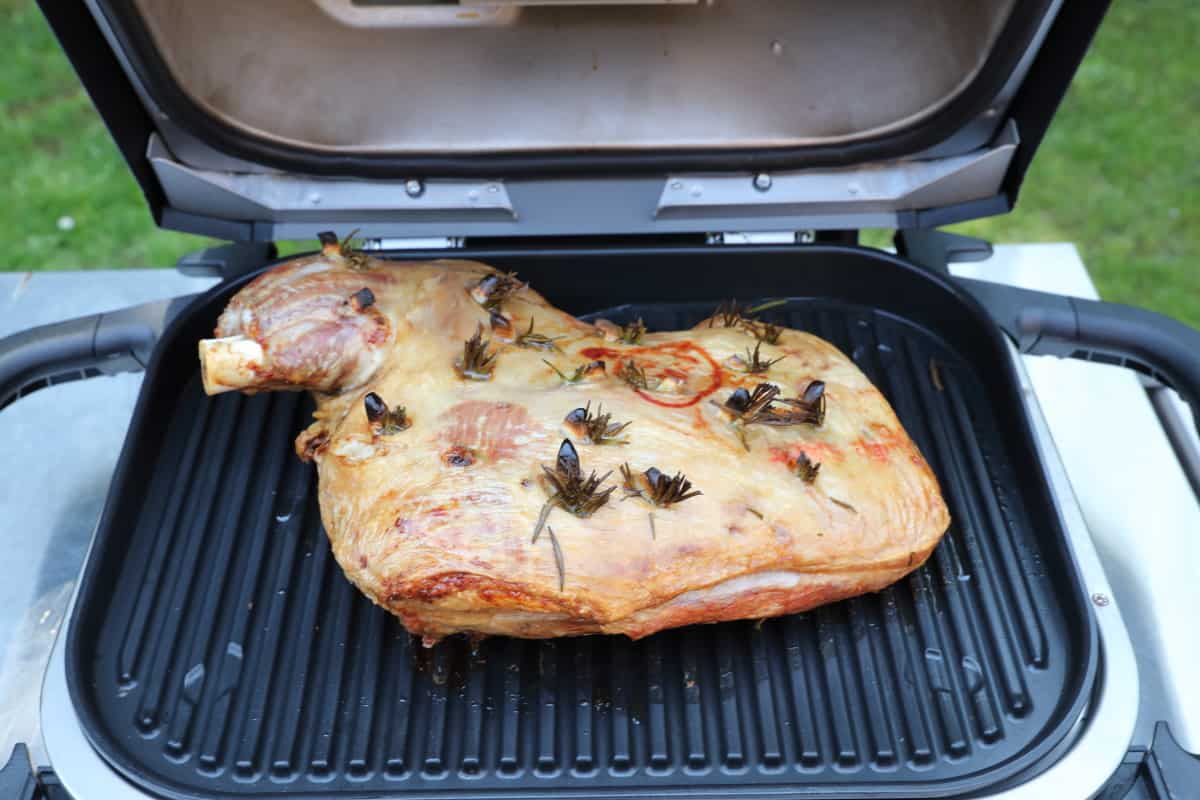 Roast lamb shoulder on the grate of a Ninja Woodfire.