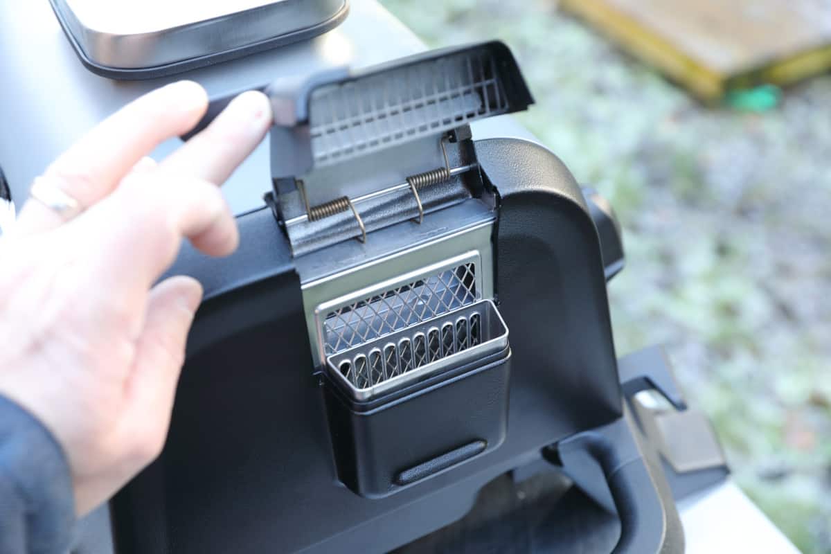 Close up of the wood pellet box on the Ninja Woodfire outdoor grill.