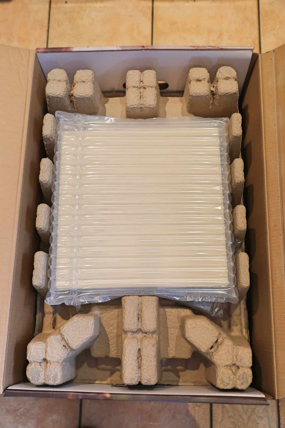 Ooni Karu 12 in box with upper packaging removed to show what's inside.