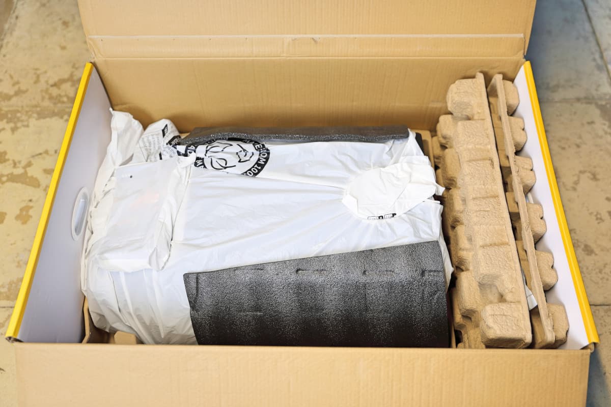 Ooni Karu 16 box opened, with top layers of packaging removed, showing the pizza oven body inside.