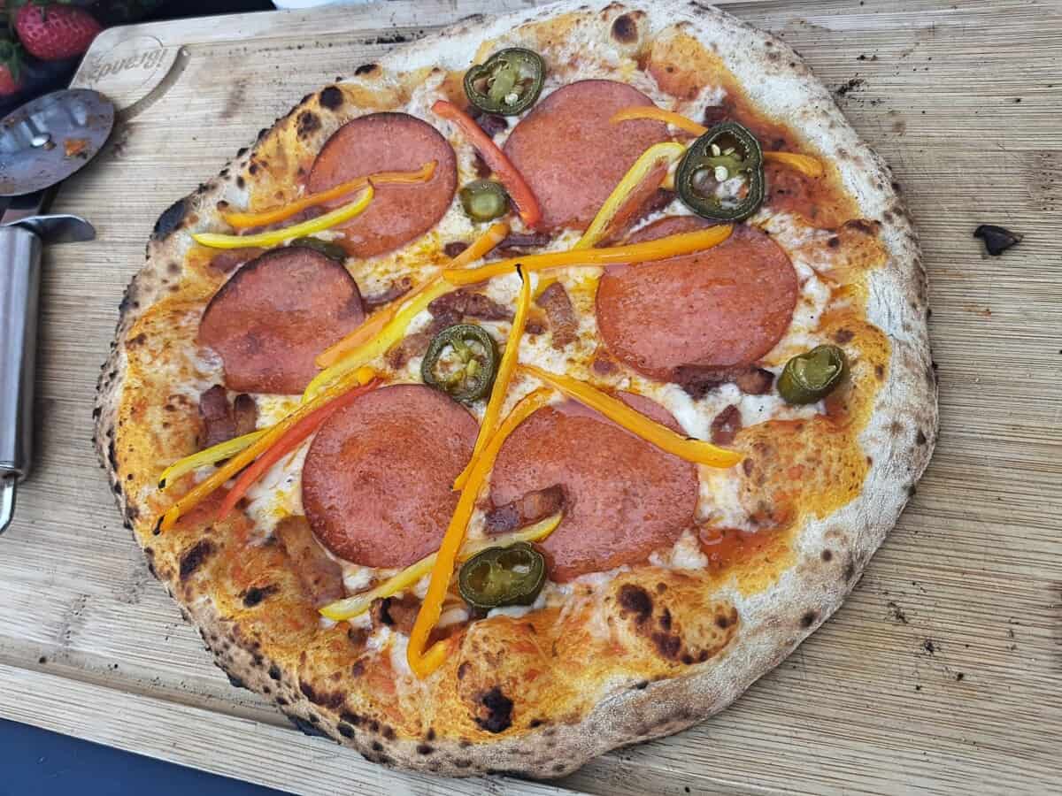 A pizza made on the Ooni Karu 12 pizza oven.