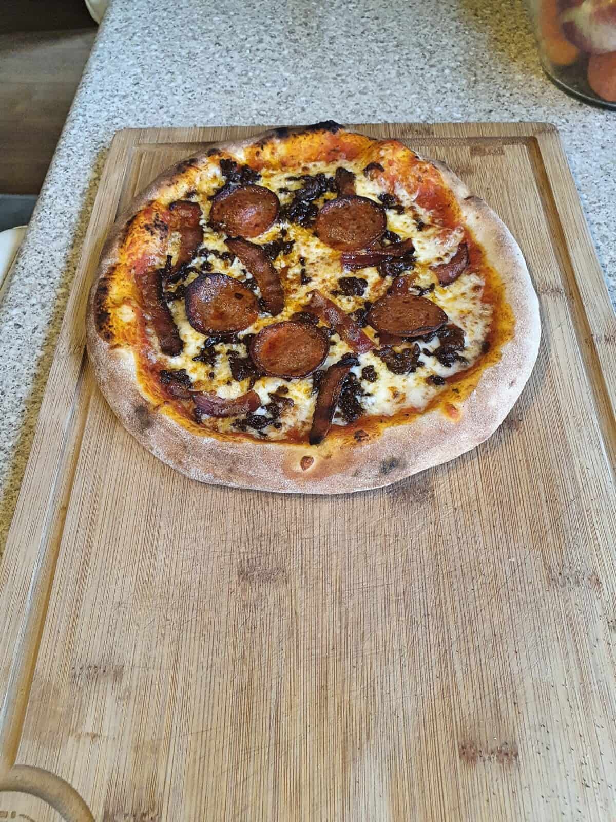 A pizza made on the Ooni Karu 12 pizza oven.